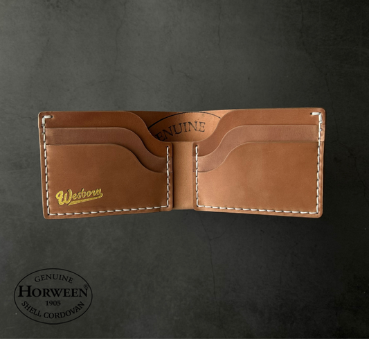 Brown leather wallet with Westwood branding on a dark gray background