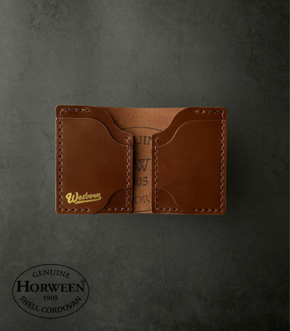 Brown leather wallet with 'Western' branding on a dark gray background